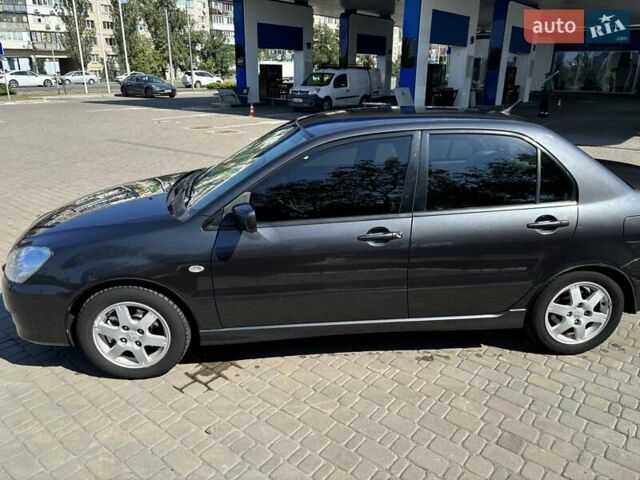 Сірий Міцубісі Lancer, об'ємом двигуна 1.58 л та пробігом 167 тис. км за 5100 $, фото 1 на Automoto.ua