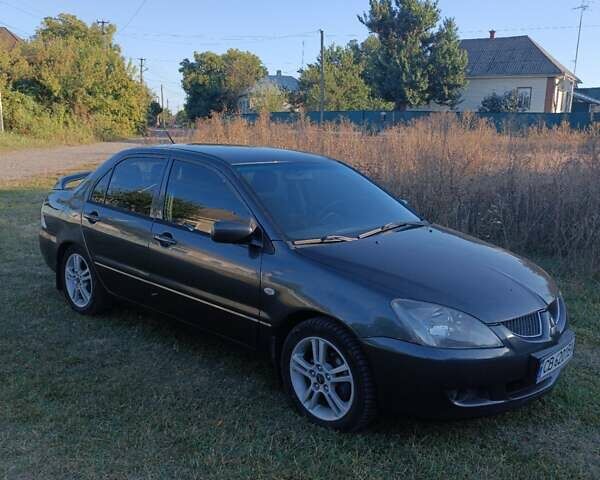 Мицубиси Лансер 2004 в Нежине на Automoto.ua Серый Мицубиси Лансер, объемом двигателя 2 л и пробегом 280 тыс. км за 6000 $, фото 10 на Automoto.ua