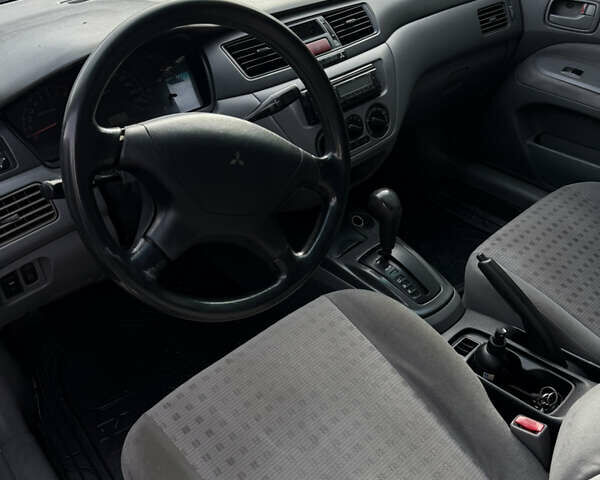 Серый Мицубиси Лансер, объемом двигателя 1.29 л и пробегом 263 тыс. км за 3400 $, фото 7 на Automoto.ua