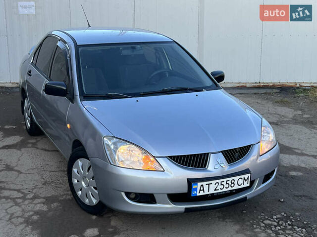 Серый Мицубиси Лансер, объемом двигателя 1.6 л и пробегом 320 тыс. км за 3650 $, фото 5 на Automoto.ua