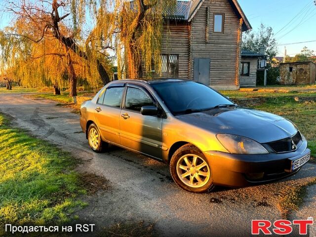 Серый Мицубиси Лансер, объемом двигателя 1.6 л и пробегом 275 тыс. км за 3000 $, фото 2 на Automoto.ua