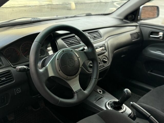 Серый Мицубиси Лансер, объемом двигателя 2 л и пробегом 180 тыс. км за 3700 $, фото 10 на Automoto.ua