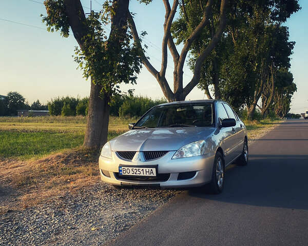 Сірий Міцубісі Lancer, об'ємом двигуна 1.58 л та пробігом 270 тис. км за 1999 $, фото 8 на Automoto.ua