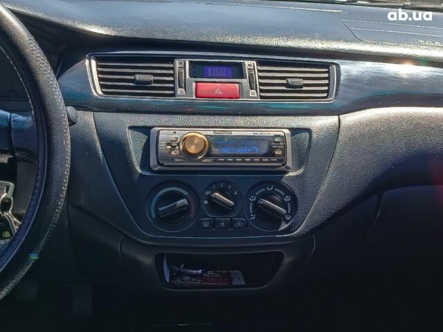 Мицубиси Лансер 2004 в Харькове на Automoto.ua Серый Мицубиси Лансер, объемом двигателя 1.6 л и пробегом 284 тыс. км за 4990 $, фото 16 на Automoto.ua