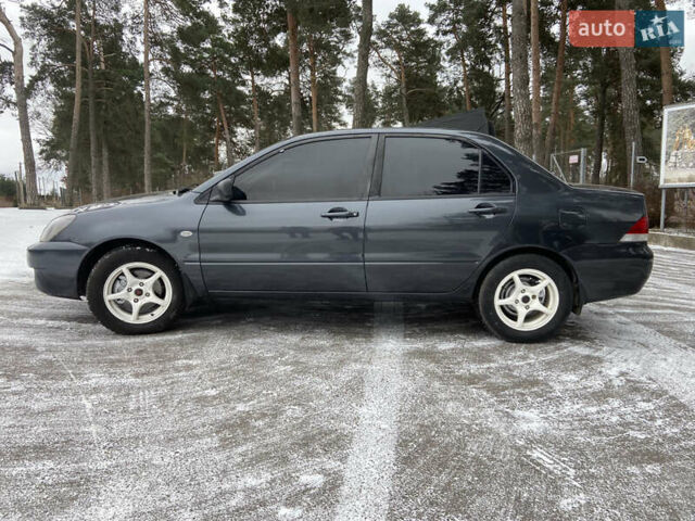 Серый Мицубиси Лансер, объемом двигателя 1.58 л и пробегом 265 тыс. км за 3499 $, фото 1 на Automoto.ua