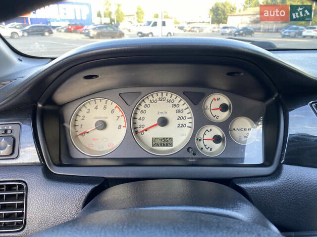 Сірий Міцубісі Lancer, об'ємом двигуна 1.58 л та пробігом 270 тис. км за 1999 $, фото 10 на Automoto.ua