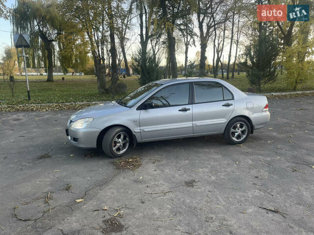 Сірий Міцубісі Lancer, об'ємом двигуна 1.58 л та пробігом 271 тис. км за 3000 $, фото 9 на Automoto.ua