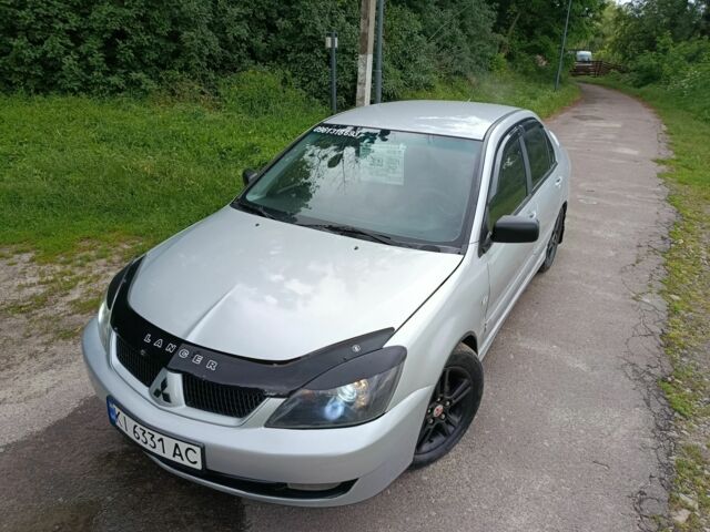 Сірий Міцубісі Lancer, об'ємом двигуна 2 л та пробігом 240 тис. км за 3500 $, фото 7 на Automoto.ua