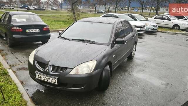 Сірий Міцубісі Lancer, об'ємом двигуна 1.58 л та пробігом 110 тис. км за 2999 $, фото 2 на Automoto.ua