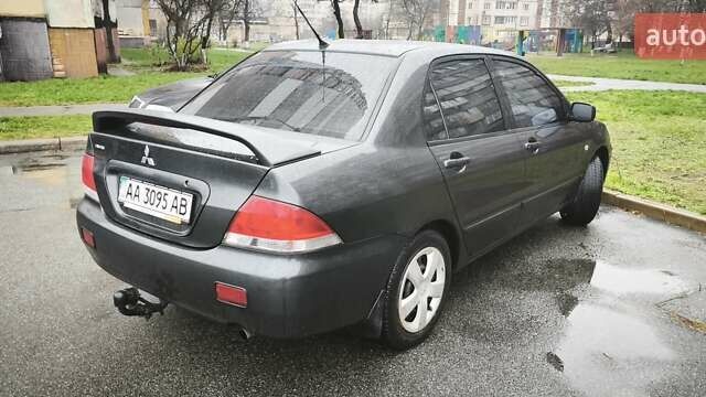 Сірий Міцубісі Lancer, об'ємом двигуна 1.58 л та пробігом 110 тис. км за 2999 $, фото 7 на Automoto.ua