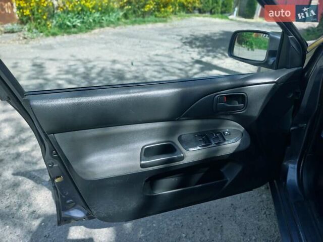 Сірий Міцубісі Lancer, об'ємом двигуна 1.58 л та пробігом 232 тис. км за 2949 $, фото 10 на Automoto.ua