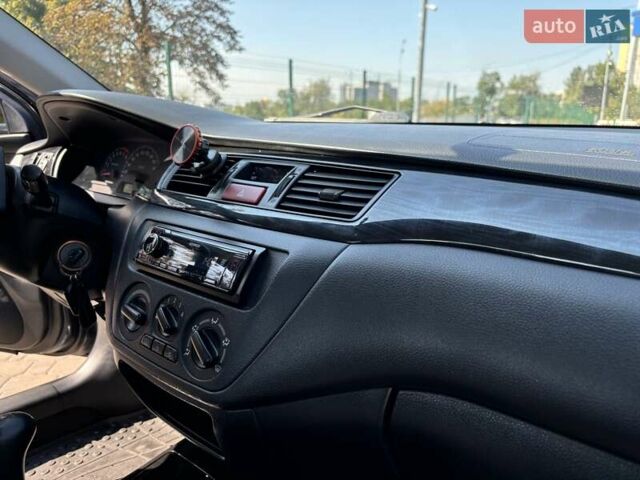Сірий Міцубісі Lancer, об'ємом двигуна 1.58 л та пробігом 167 тис. км за 5100 $, фото 37 на Automoto.ua