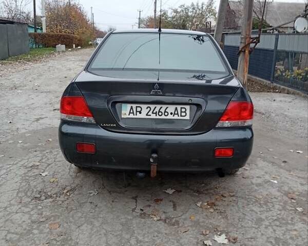 Серый Мицубиси Лансер, объемом двигателя 1.6 л и пробегом 372 тыс. км за 3500 $, фото 1 на Automoto.ua