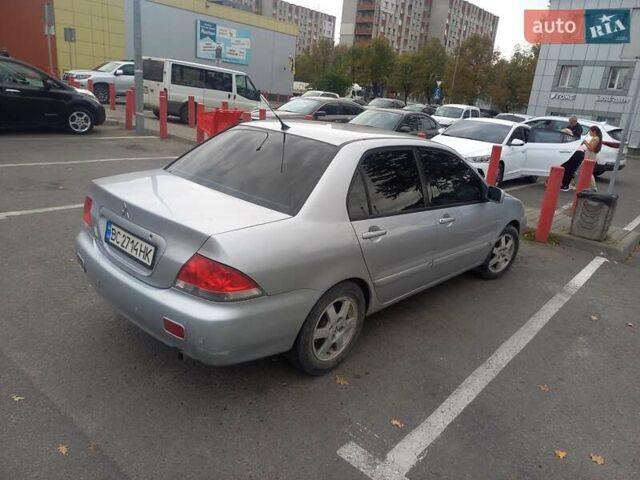 Серый Мицубиси Лансер, объемом двигателя 1.58 л и пробегом 359 тыс. км за 3800 $, фото 3 на Automoto.ua
