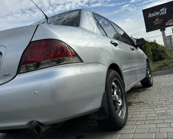 Серый Мицубиси Лансер, объемом двигателя 1.29 л и пробегом 263 тыс. км за 3400 $, фото 2 на Automoto.ua