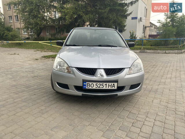 Сірий Міцубісі Lancer, об'ємом двигуна 1.58 л та пробігом 268 тис. км за 3799 $, фото 1 на Automoto.ua
