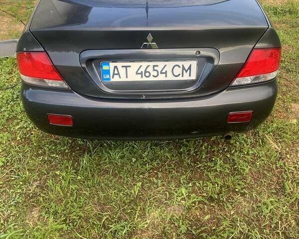 Серый Мицубиси Лансер, объемом двигателя 1.58 л и пробегом 291 тыс. км за 2930 $, фото 3 на Automoto.ua
