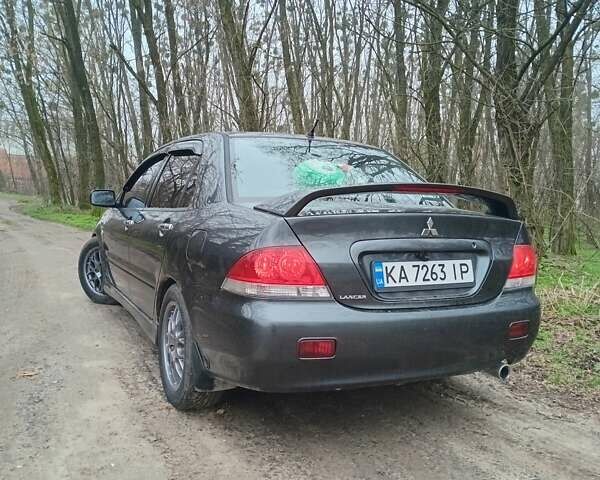 Сірий Міцубісі Lancer, об'ємом двигуна 1.58 л та пробігом 360 тис. км за 4000 $, фото 5 на Automoto.ua