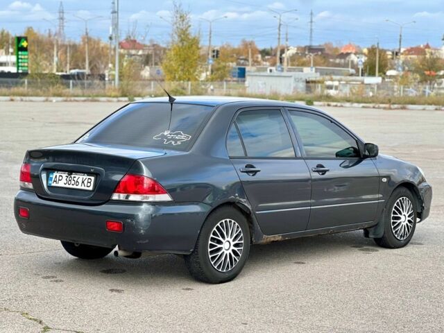 Серый Мицубиси Лансер, объемом двигателя 1.6 л и пробегом 490 тыс. км за 1799 $, фото 6 на Automoto.ua