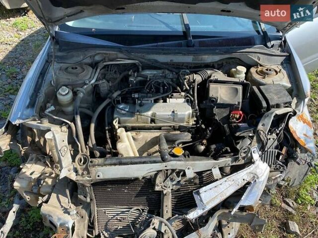 Серый Мицубиси Лансер, объемом двигателя 1.6 л и пробегом 290 тыс. км за 1600 $, фото 1 на Automoto.ua