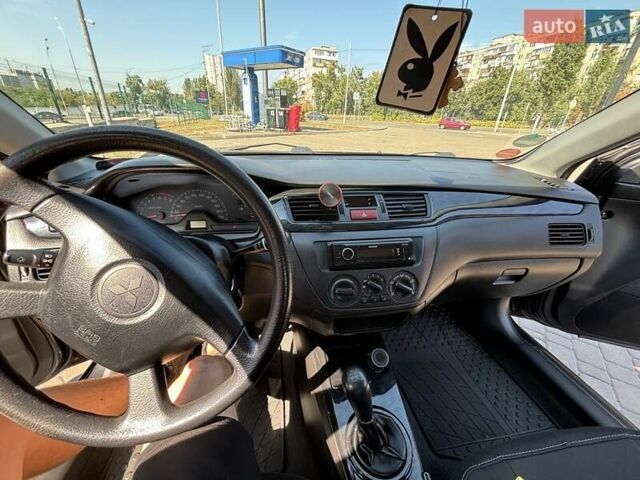 Сірий Міцубісі Lancer, об'ємом двигуна 1.58 л та пробігом 167 тис. км за 5100 $, фото 29 на Automoto.ua