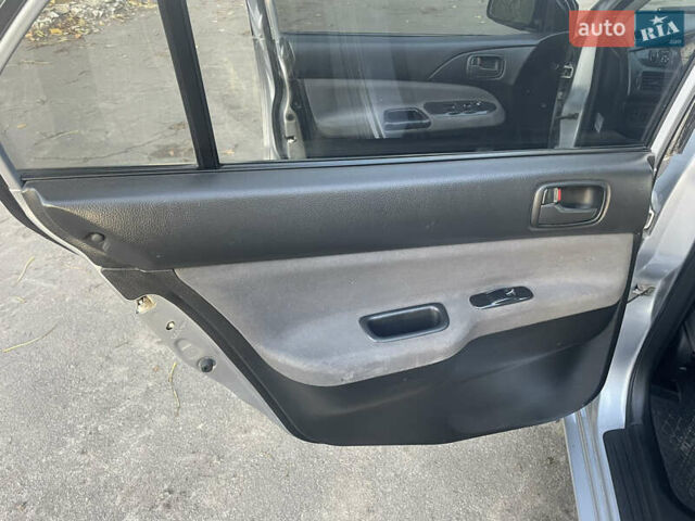 Сірий Міцубісі Lancer, об'ємом двигуна 1.58 л та пробігом 271 тис. км за 3000 $, фото 21 на Automoto.ua
