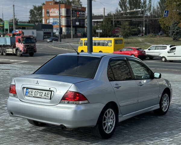 Сірий Міцубісі Lancer, об'ємом двигуна 1.6 л та пробігом 260 тис. км за 3899 $, фото 4 на Automoto.ua