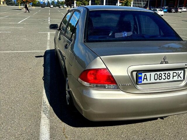 Серый Мицубиси Лансер, объемом двигателя 1.3 л и пробегом 245 тыс. км за 3000 $, фото 1 на Automoto.ua