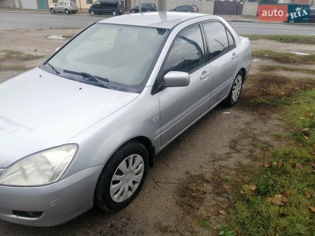 Міцубісі Lancer 2004 у Харкові на Automoto.ua Сірий Міцубісі Lancer, об'ємом двигуна 1.58 л та пробігом 248 тис. км за 3550 $, фото 10 на Automoto.ua