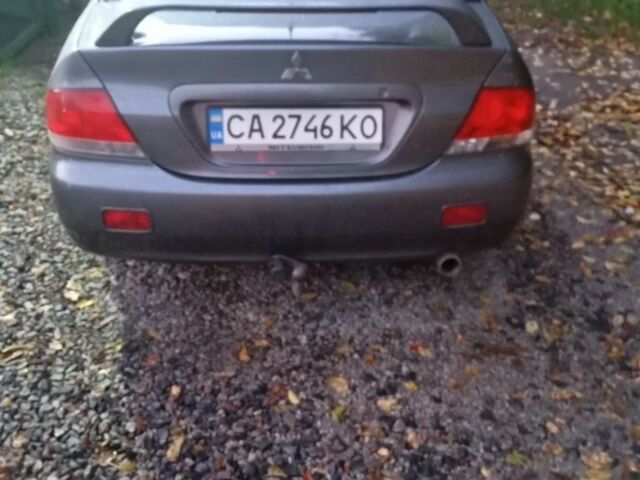 Мицубиси Лансер 2004 в Черкассах на Automoto.ua Серый Мицубиси Лансер, объемом двигателя 1.6 л и пробегом 313 тыс. км за 4800 $, фото 3 на Automoto.ua