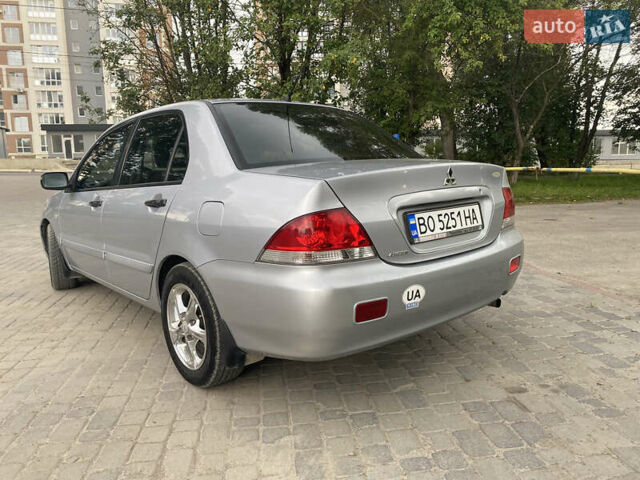 Сірий Міцубісі Lancer, об'ємом двигуна 1.58 л та пробігом 268 тис. км за 3799 $, фото 6 на Automoto.ua
