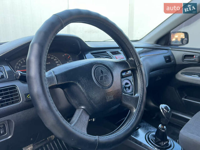 Серый Мицубиси Лансер, объемом двигателя 1.6 л и пробегом 320 тыс. км за 3650 $, фото 27 на Automoto.ua