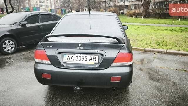 Сірий Міцубісі Lancer, об'ємом двигуна 1.58 л та пробігом 110 тис. км за 2999 $, фото 11 на Automoto.ua