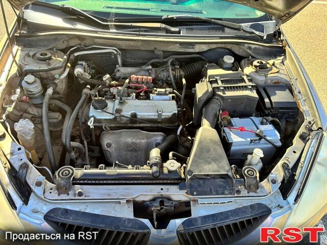 Серый Мицубиси Лансер, объемом двигателя 1.3 л и пробегом 245 тыс. км за 3000 $, фото 6 на Automoto.ua