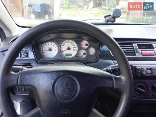 Серый Мицубиси Лансер, объемом двигателя 1.6 л и пробегом 244 тыс. км за 4000 $, фото 4 на Automoto.ua