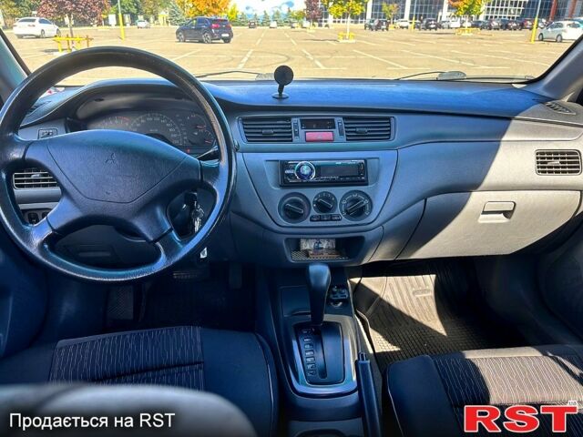Серый Мицубиси Лансер, объемом двигателя 1.3 л и пробегом 245 тыс. км за 3000 $, фото 9 на Automoto.ua