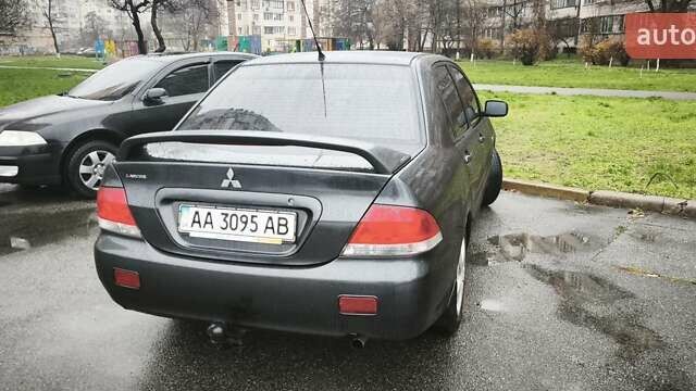 Сірий Міцубісі Lancer, об'ємом двигуна 1.58 л та пробігом 110 тис. км за 2999 $, фото 8 на Automoto.ua
