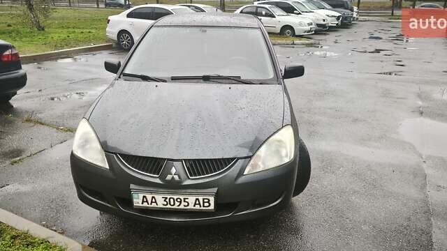 Сірий Міцубісі Lancer, об'ємом двигуна 1.58 л та пробігом 110 тис. км за 2999 $, фото 12 на Automoto.ua