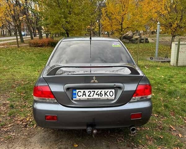Серый Мицубиси Лансер, объемом двигателя 1.58 л и пробегом 313 тыс. км за 4650 $, фото 7 на Automoto.ua