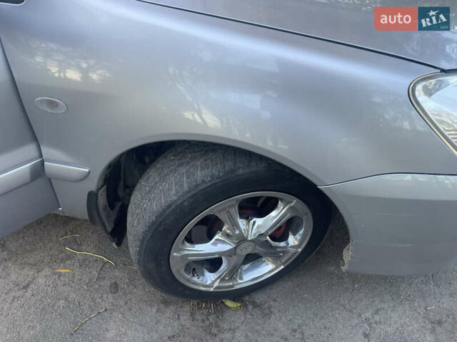 Сірий Міцубісі Lancer, об'ємом двигуна 1.58 л та пробігом 271 тис. км за 3000 $, фото 16 на Automoto.ua