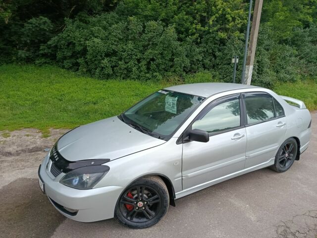 Сірий Міцубісі Lancer, об'ємом двигуна 2 л та пробігом 240 тис. км за 3500 $, фото 1 на Automoto.ua