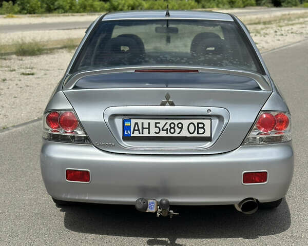 Сірий Міцубісі Lancer, об'ємом двигуна 2 л та пробігом 200 тис. км за 3550 $, фото 3 на Automoto.ua