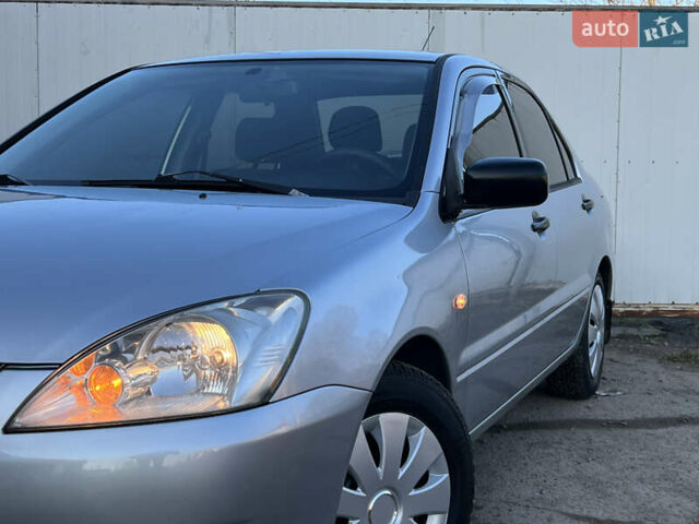 Серый Мицубиси Лансер, объемом двигателя 1.6 л и пробегом 320 тыс. км за 3650 $, фото 16 на Automoto.ua