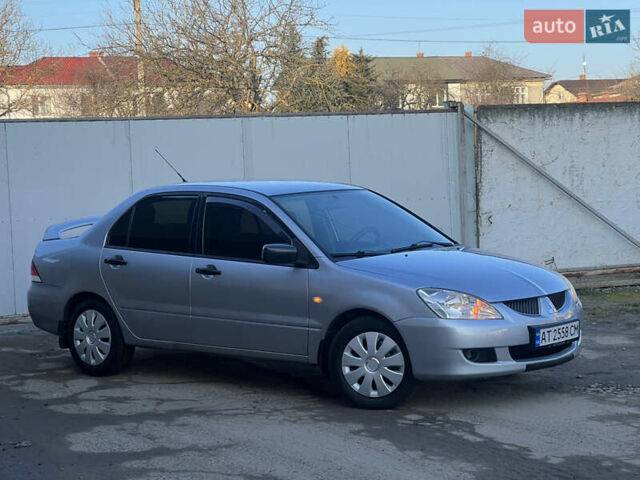 Серый Мицубиси Лансер, объемом двигателя 1.6 л и пробегом 320 тыс. км за 3650 $, фото 3 на Automoto.ua