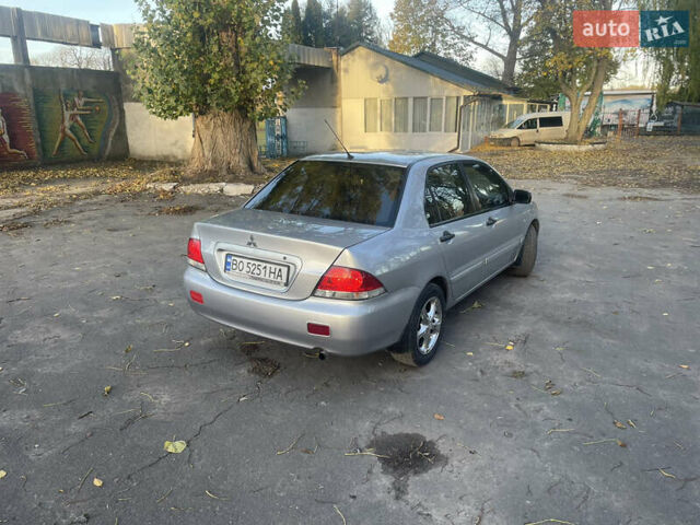 Сірий Міцубісі Lancer, об'ємом двигуна 1.58 л та пробігом 271 тис. км за 3000 $, фото 4 на Automoto.ua