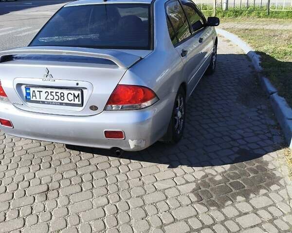 Сірий Міцубісі Lancer, об'ємом двигуна 1.58 л та пробігом 320 тис. км за 3700 $, фото 5 на Automoto.ua