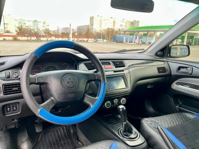 Серый Мицубиси Лансер, объемом двигателя 1.6 л и пробегом 490 тыс. км за 1799 $, фото 10 на Automoto.ua