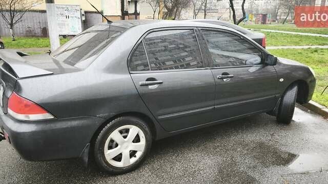 Сірий Міцубісі Lancer, об'ємом двигуна 1.58 л та пробігом 110 тис. км за 2999 $, фото 6 на Automoto.ua
