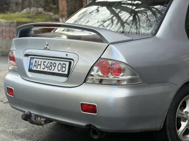 Серый Мицубиси Лансер, объемом двигателя 2 л и пробегом 180 тыс. км за 3700 $, фото 5 на Automoto.ua