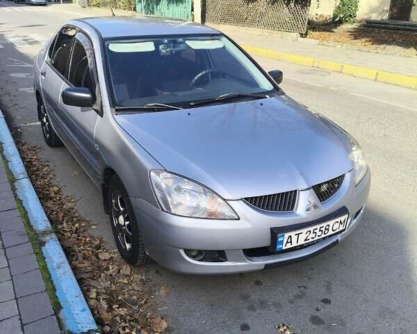 Сірий Міцубісі Lancer, об'ємом двигуна 1.58 л та пробігом 320 тис. км за 3700 $, фото 3 на Automoto.ua